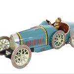 Vintage-style toy car with a driver figure on a white background