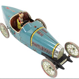 Vintage-style toy car with a driver figure on a white background