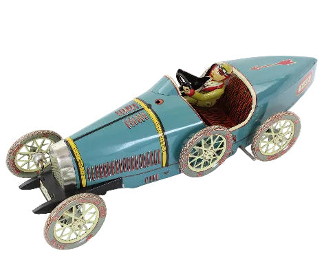 Vintage toy car with a driver figure on a white background