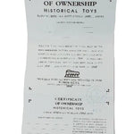 Certificate of ownership for historical toys on a textured white background