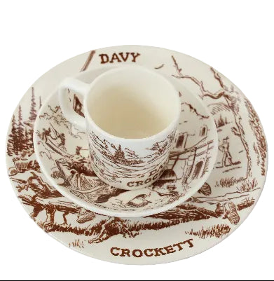 Ceramic cup and saucer set with 'Davy Crockett' design on a white background