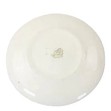 White ceramic plate with a logo on a white background