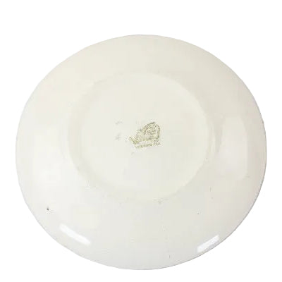 White ceramic plate with a logo on a white background