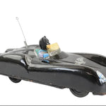 Vintage toy car with a black body and metallic finish on a white background