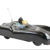 Vintage toy car with a black body and metallic finish on a white background