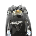 Black Batmobile toy on a white background