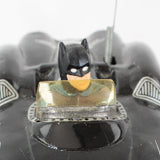 Black Batmobile toy on a white background