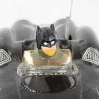 Black Batmobile toy on a white background