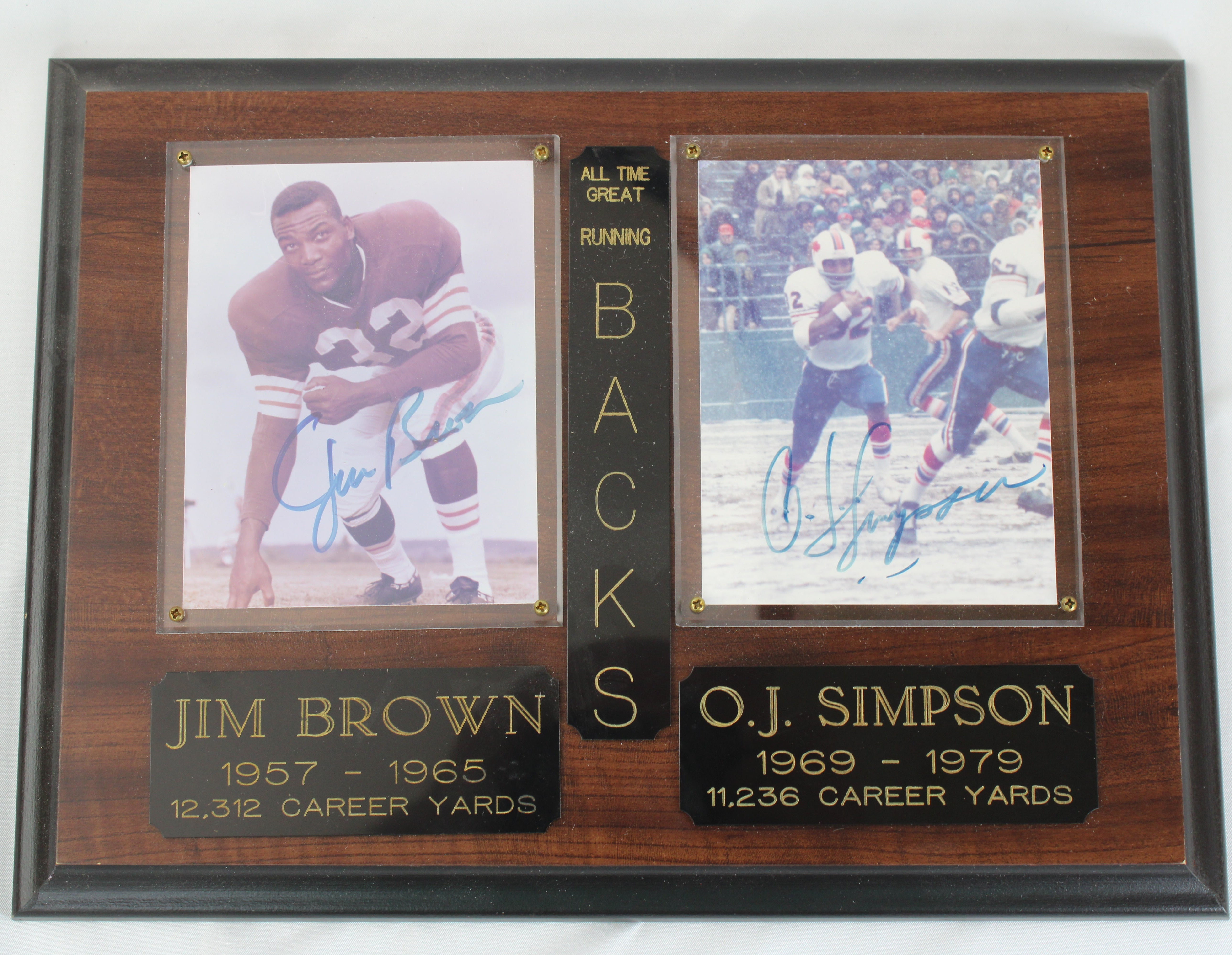 Plaque with autographed photos of Jim Brown and O.J. Simpson on a white background