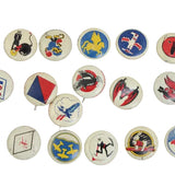 Collection of vintage buttons with various designs on a white background