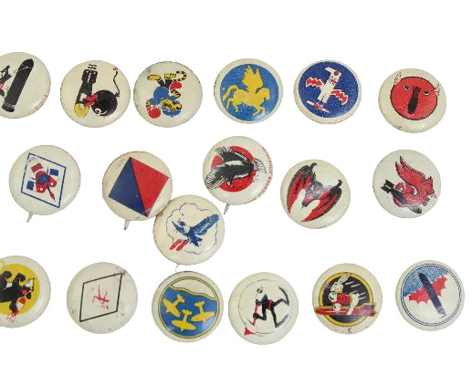 Collection of vintage buttons with various designs on a white background