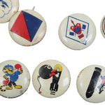Collection of vintage buttons with various designs on a white background