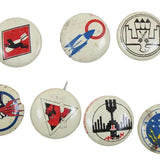 Collection of vintage buttons with various designs on a white background