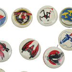 Collection of vintage buttons with various designs on a white background