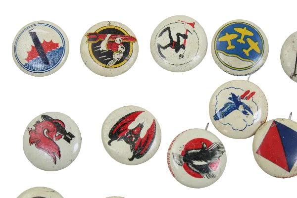 Collection of vintage buttons with various designs on a white background