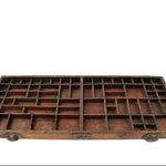 Wooden type tray with multiple compartments on a white background