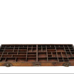 Wooden tray with multiple compartments on a white background