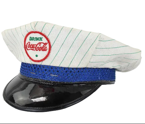 Vintage Coca-Cola cap with a white brim and blue band on a white background
