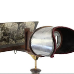 Vintage stereoscope with a glass plate on a white background