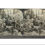 Vintage stereoscopic card showing a scene with soldiers and supplies, likely from World War I.