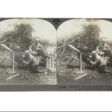 Stereoscopic card showing a German machine gun crew in action, published by Keystone View Company.