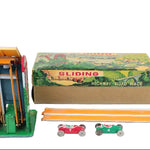 Toy track set with cars and packaging on a white background