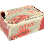 Vintage toy car packaging with 'Schuco' branding on a white background