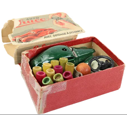 Toy car set with components in a box on a white background