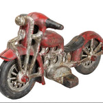 Vintage toy motorcycle with red body and silver metal parts on a white background