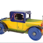 Vintage Louis Marx toy car with a colorful design on a white background