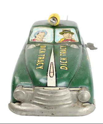 Vintage toy car with 'Dick Tracy' branding on a white background