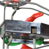 Mechanical component with 'Made in Germany' label on a colorful background