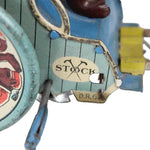 Vintage toy with 'Stock' branding on a white background