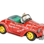 Red toy car with text and a small figure inside on a white background