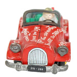 Red toy car with a character inside on a white background