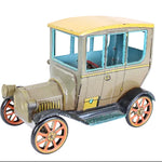 Model of an Model-T car on a white background