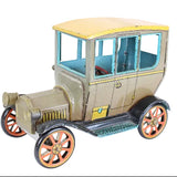 Model of an Model-T car on a white background