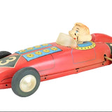 Toy race car with Howdy Doody inside on a white background