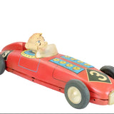 Red toy race car with Howdy Doody inside on a white background