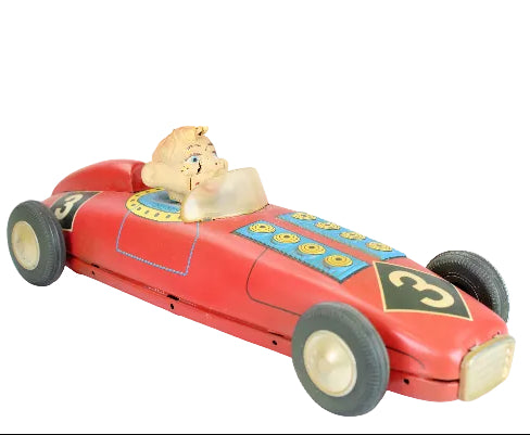 Red toy race car with Howdy Doody inside on a white background