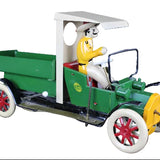 Model of a vintage green truck with a driver figure on a dark background
