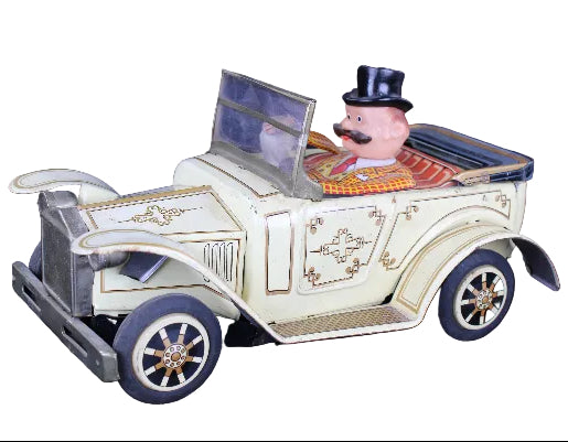 Toy car with a character in a top hat on a dark background