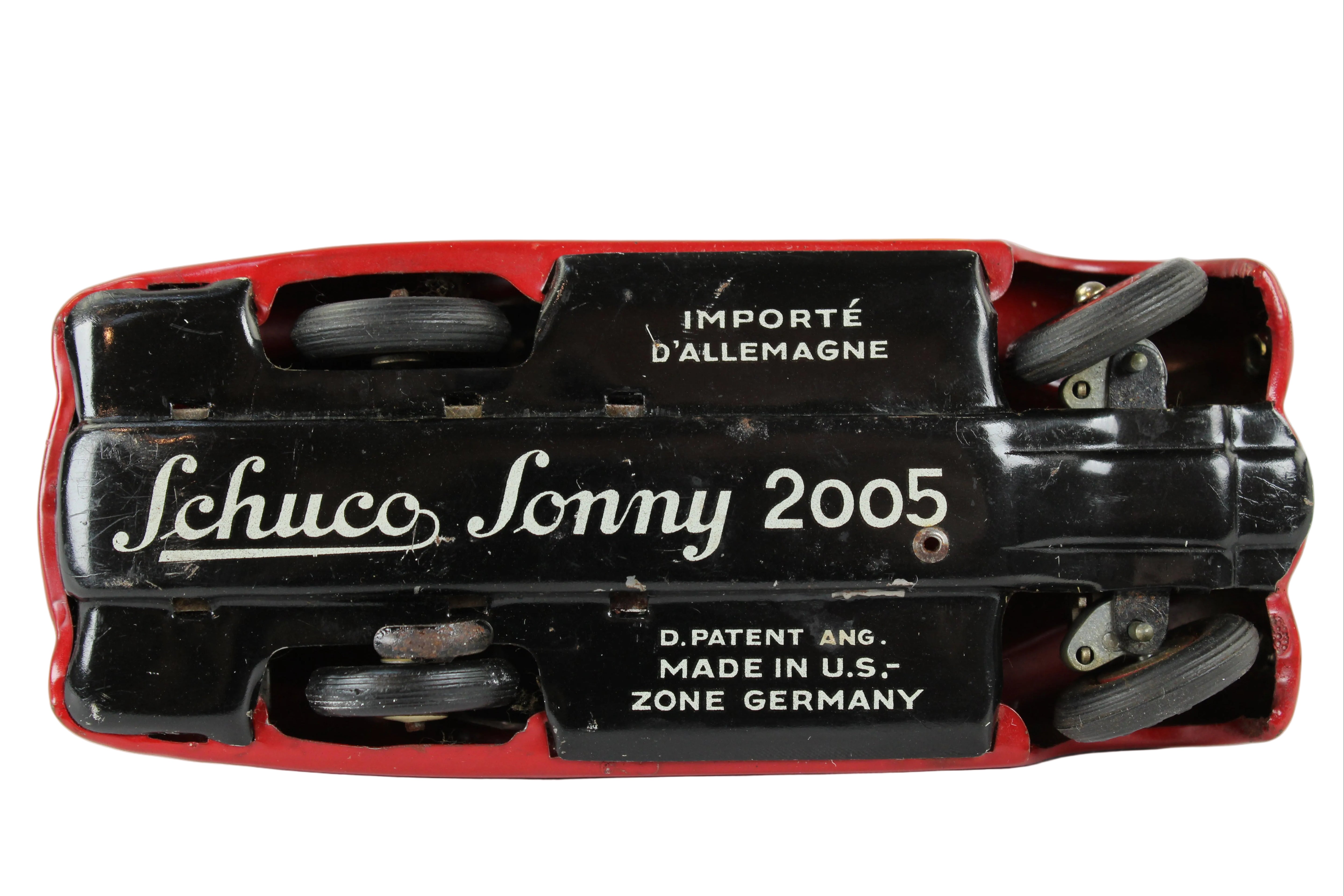 Back view of a Schuco Sonny 2005 toy car with branding and text on a white background