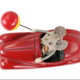 Toy car with a mouse figure inside on a white background