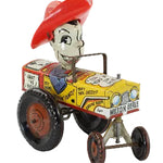 Toy tractor with Milton Berle character in a red hat on a white background