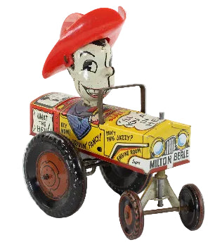 Toy tractor with Milton Berle character in a red hat on a white background