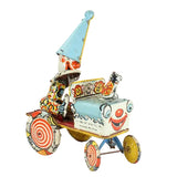 Colorful vintage toy car with a clown face on a white background