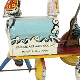 Vintage toy cart with colorful design and 'Unique Art Mfg. Co., Inc.' branding on a white background