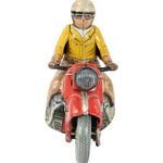 Toy figure of a person on a red motorcycle with a white background