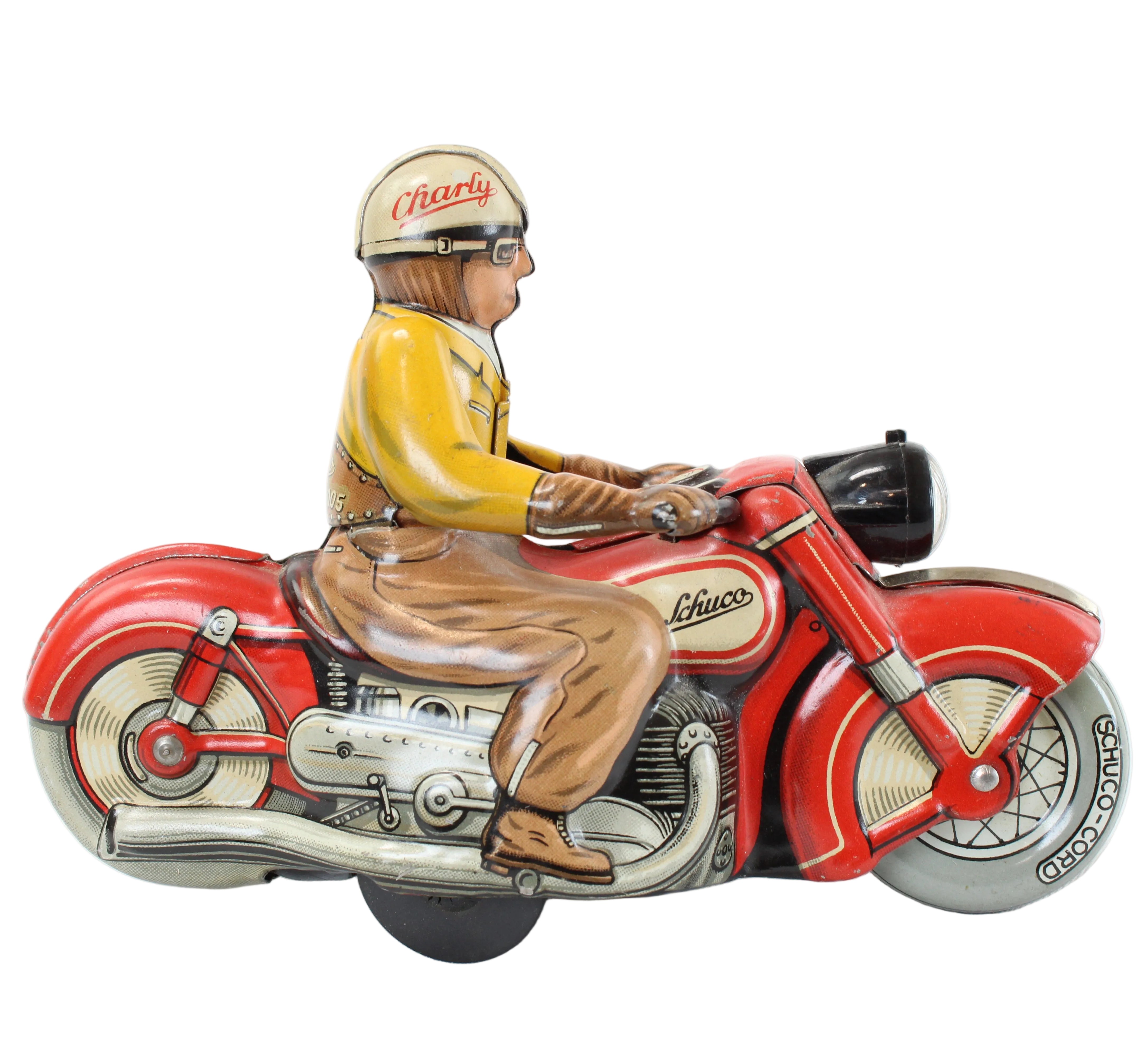 Model of a man riding a red motorcycle on a white background